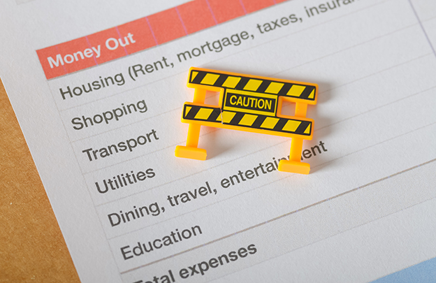 Financial Planning Warning Sign on Expense Worksheet